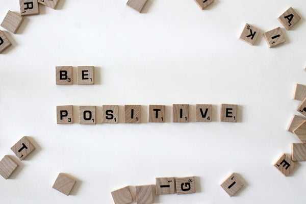 Be positive scrabble pieces positivity quote - Photo by Amanda Jones on Unsplashpositive affirmations -