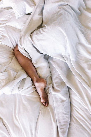 Picture of legs in bed for restless legs